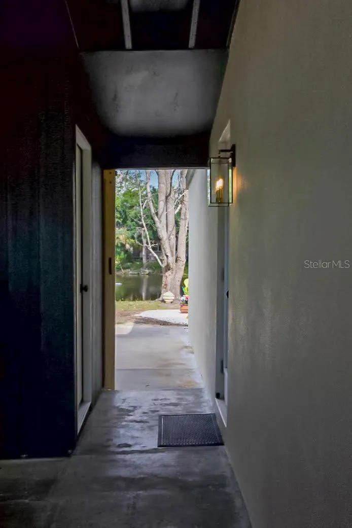 Walk Way from main living to Laundry Room and Car Port