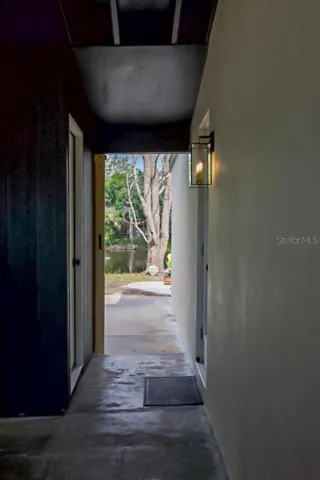 Walk Way from main living to Laundry Room and Car Port
