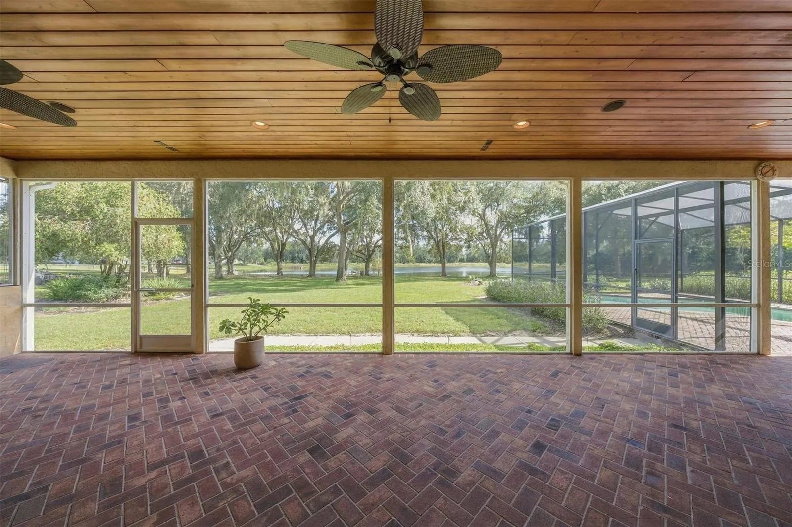HUGE LANAI WITH TONGUE &amp; GROOVE WOOD CEILING OVERLOOKING THE PEACFUL LAND WITH LAKE VIEWS