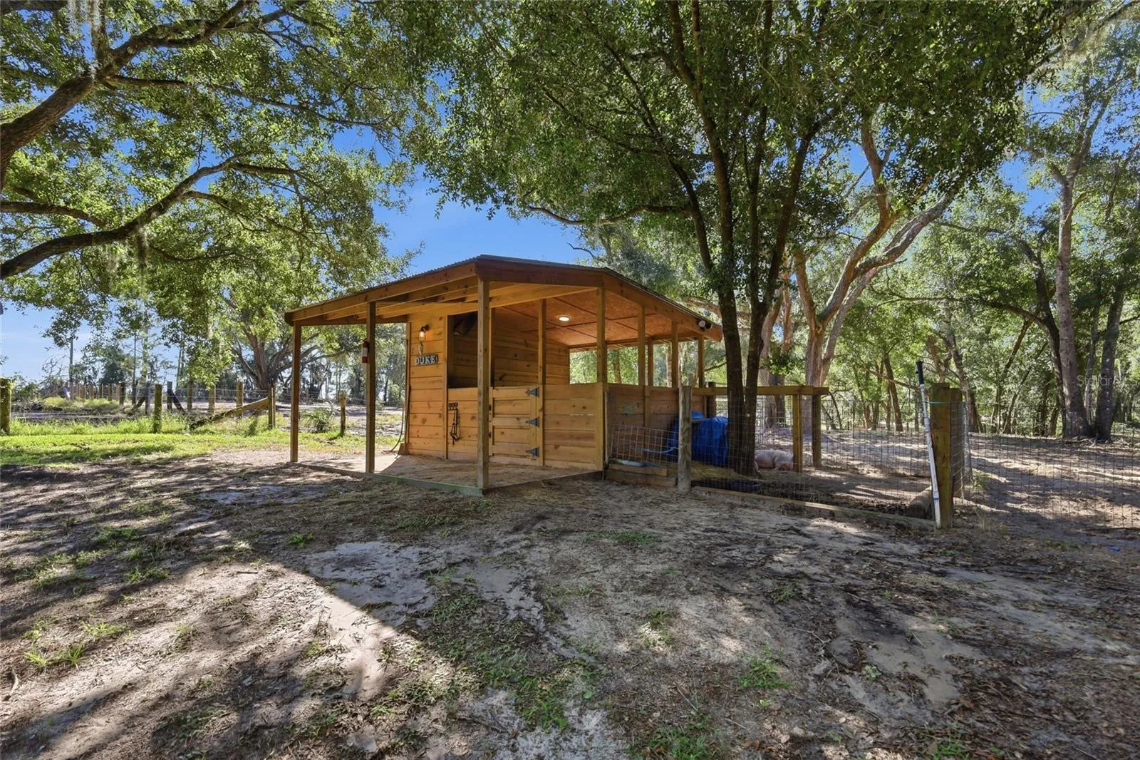 1 horse stall with storage, water & electricity. Attached to 1 of 3 large fenced in areas