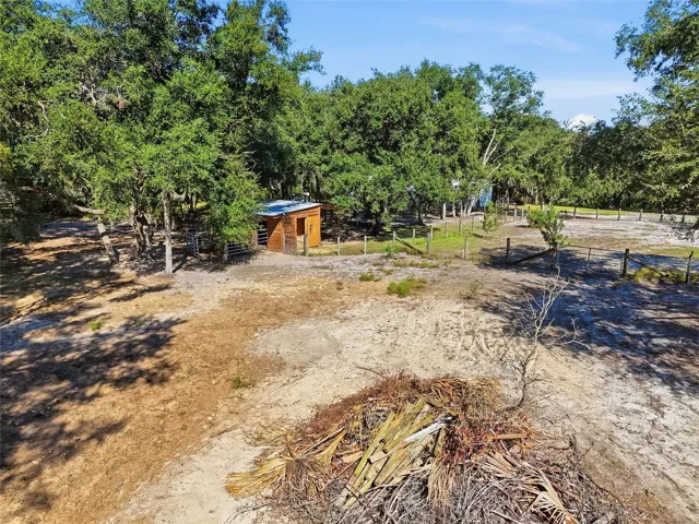 Side view of horse stall. 1 of 3 fenced in areas
