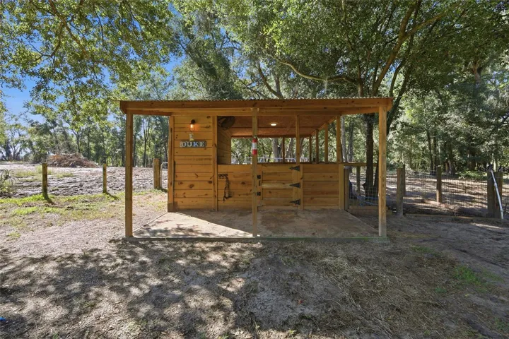 1 horse stall with storage, water & electricity. Attached to 1 of 3 large fenced in areas