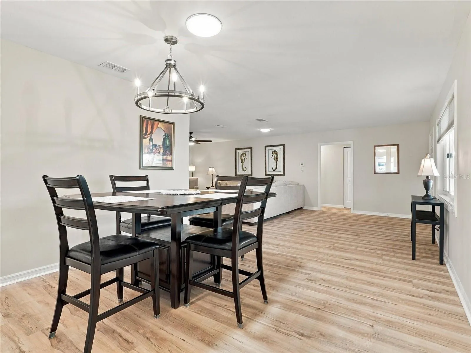 Dining Room with Table for 4 and Solar Tube and New Light Fixture