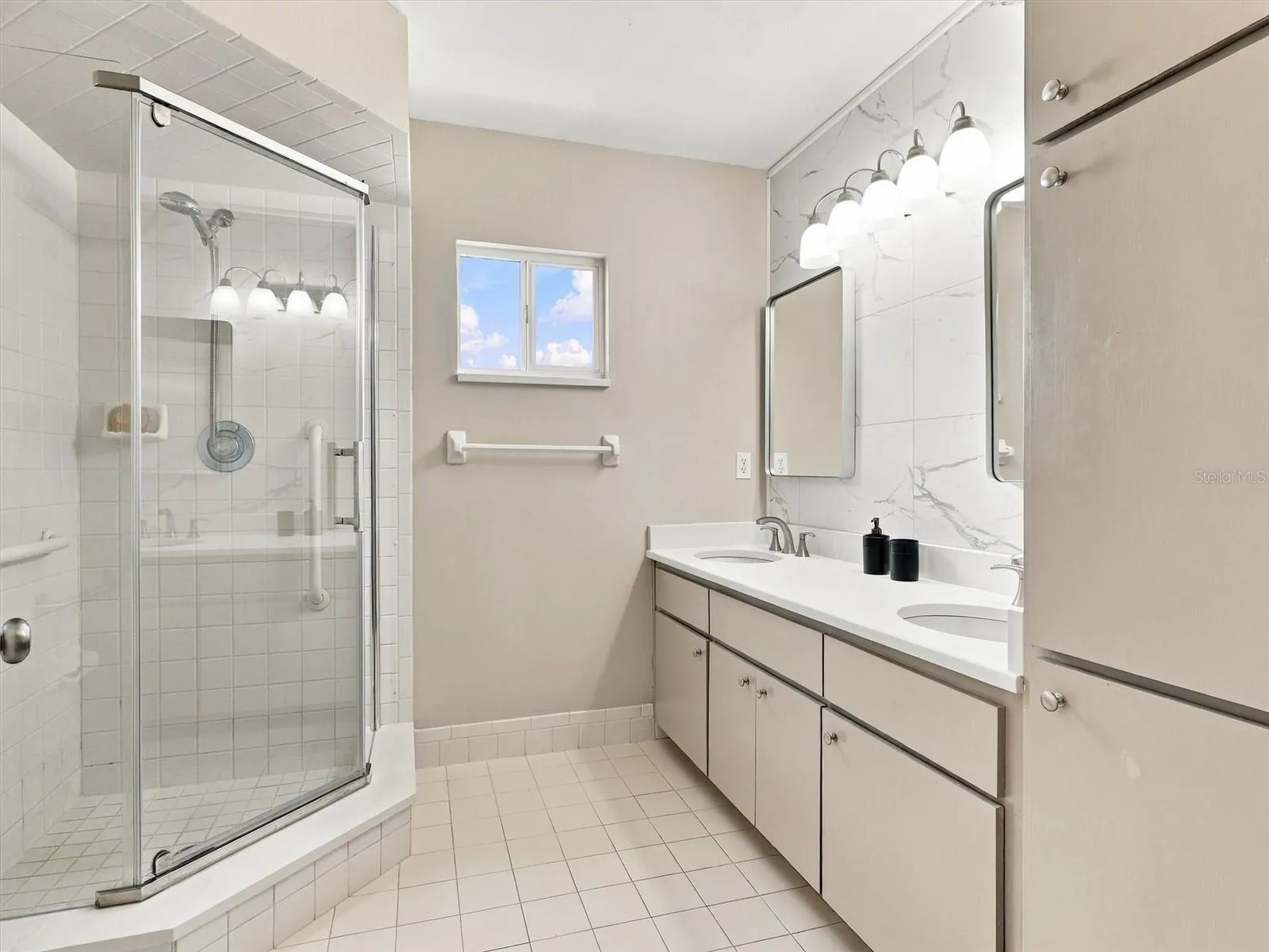 Primary En-Suite Bathroom - updated with 2 sinks, mirror, toilet, countertops, painted cabinets