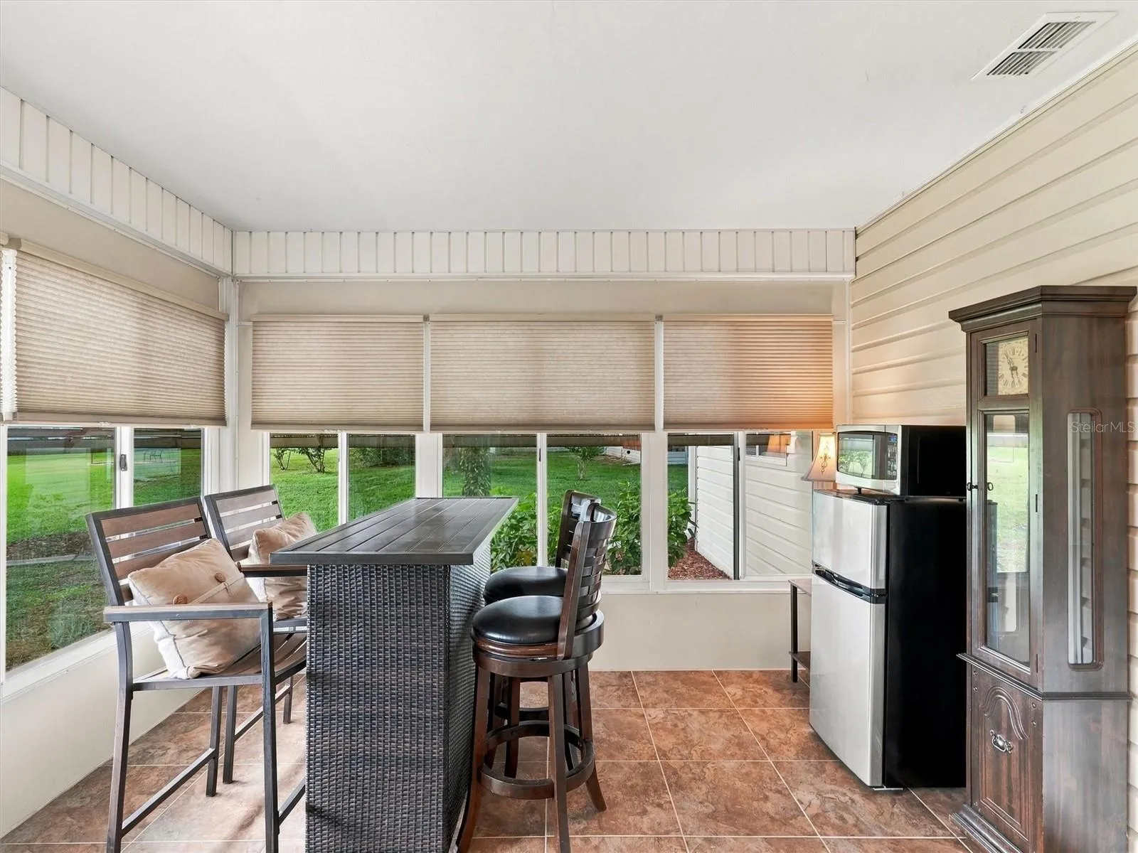 Lanai / Den includes a High Top Table and Fridge/Microwave