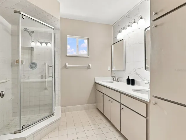 Primary En-Suite Bathroom - updated with 2 sinks, mirror, toilet, countertops, painted cabinets