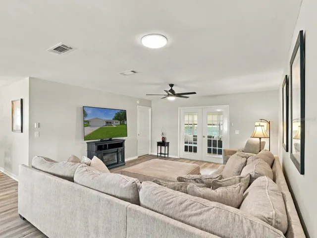 Living Room with Comfortable Sofa and 65" TV, Solar Tube