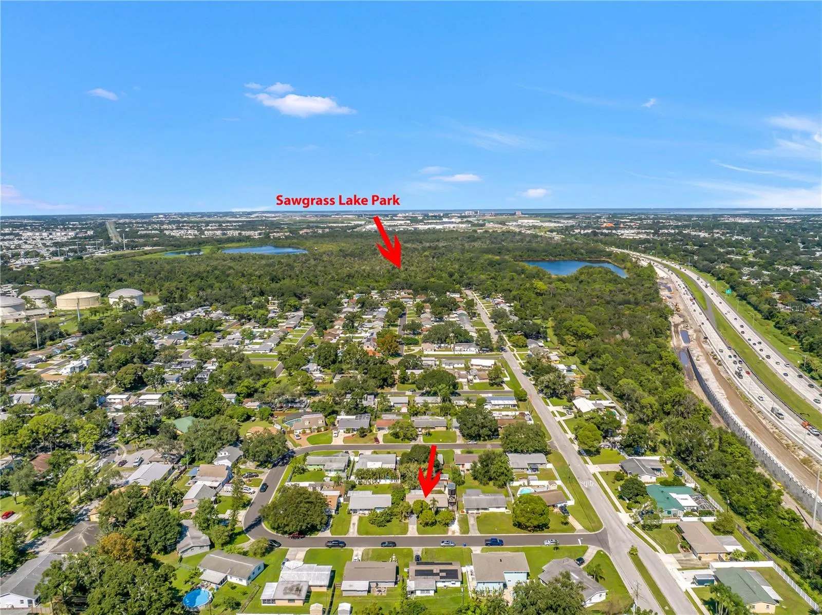 Sawgrass Lake Park's entrance is at the top of the neighborhood. It's a leisurely walk on the sidewalk to the park, often enjoyed by neighbors, with and without dogs.