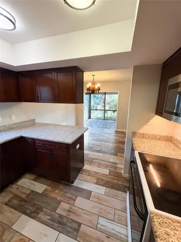 Kitchen View To Dining &amp; Sunroom