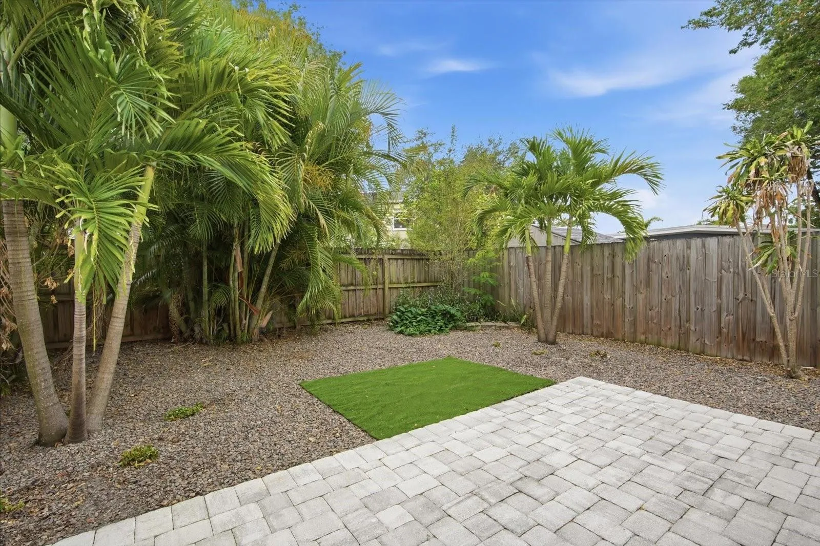 Fenced back yard with extra area on side for kayaks, bikes ect