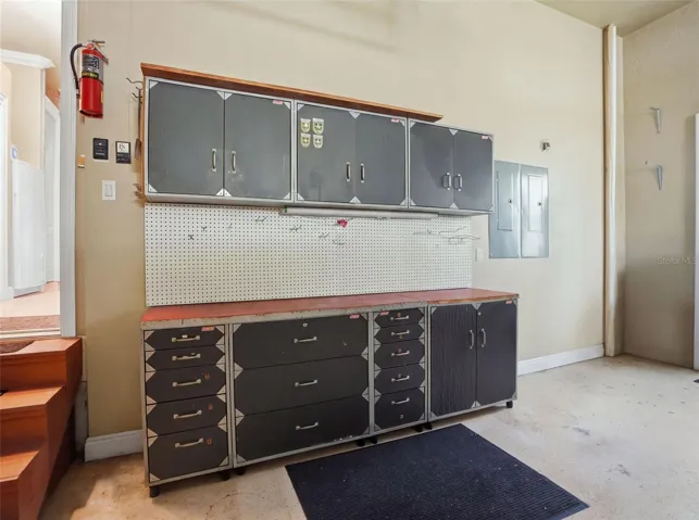Workshop table and cabinets in the 3-car garage.