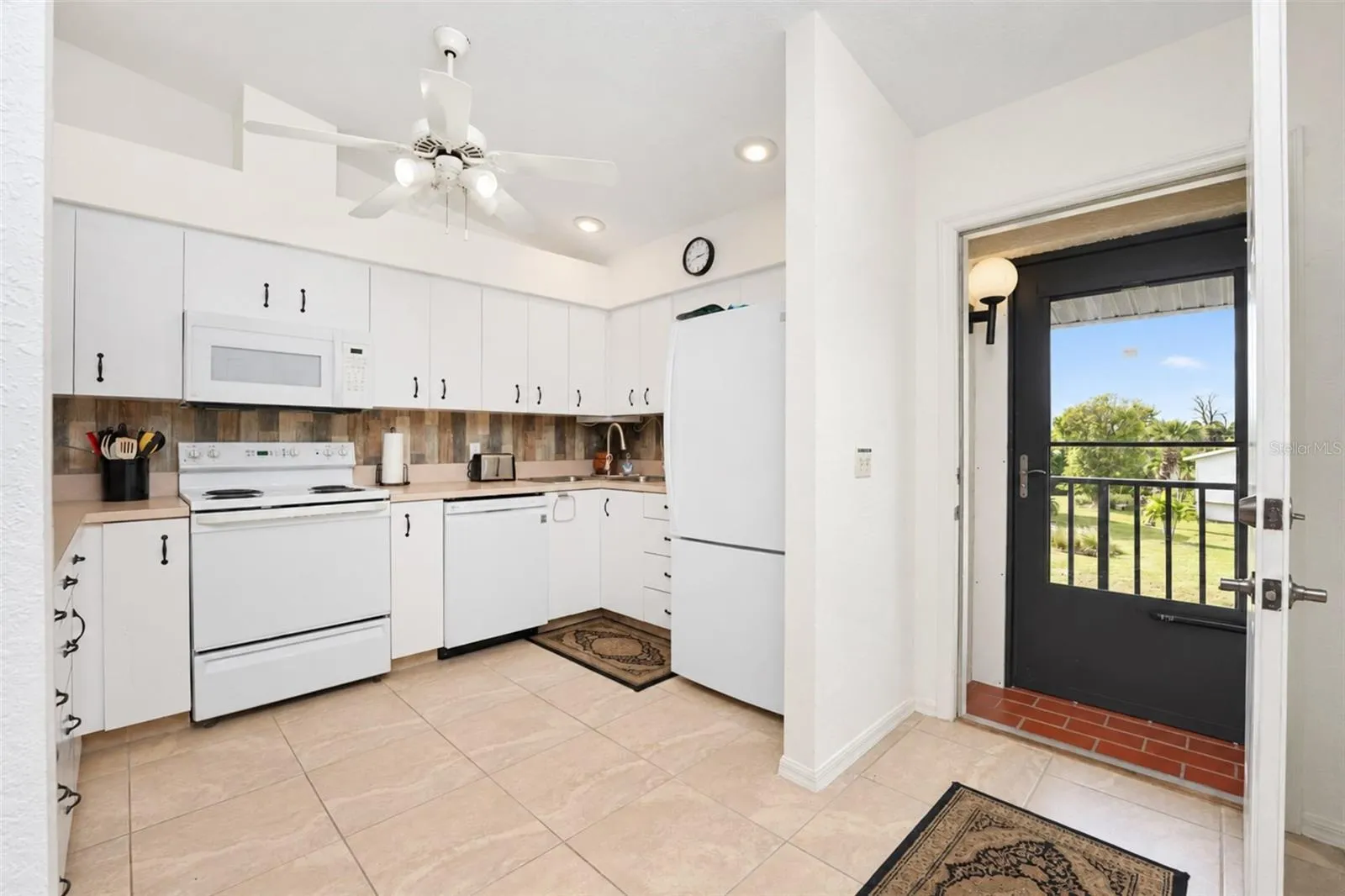 The kitchen is conveniently located upon entry.