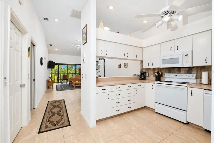 The kitchen offers abundant cabinetry and counter space.