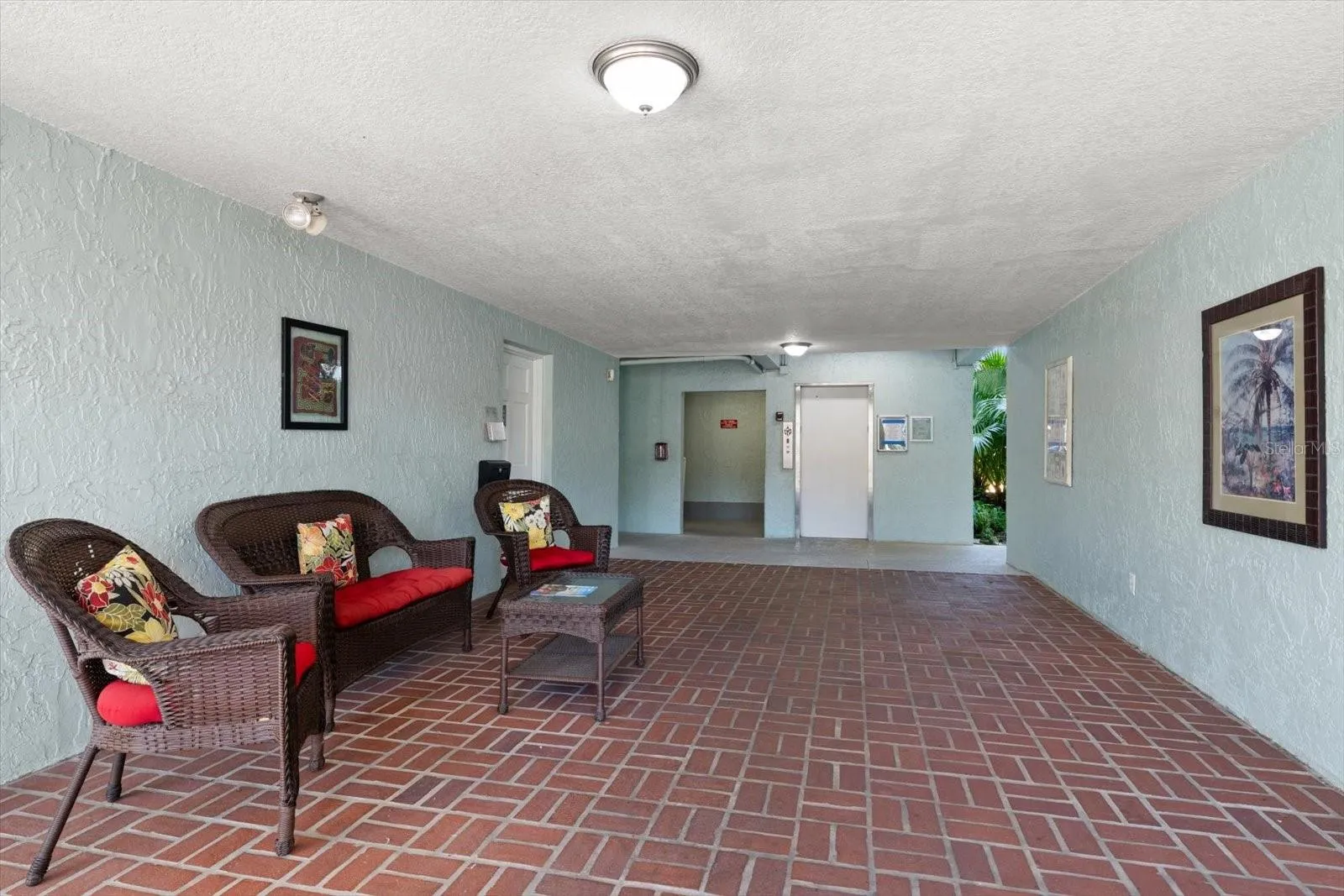 Ground floor building entrance to elevator, bike storage and laundry facility