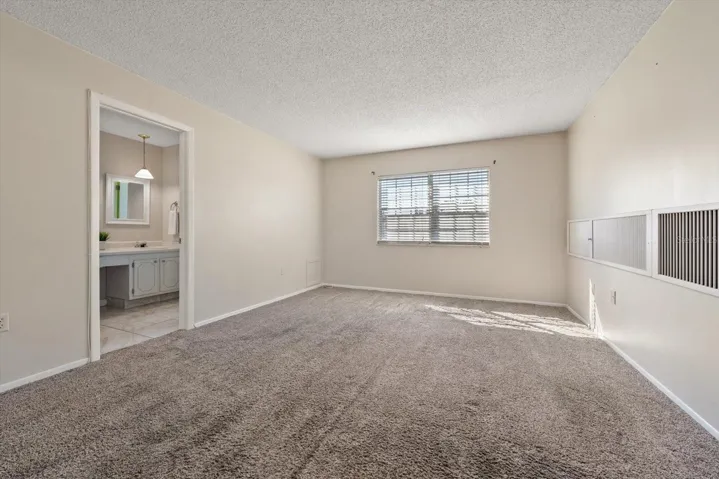 Primary suite with additional closet, en suite bath and walk in closet