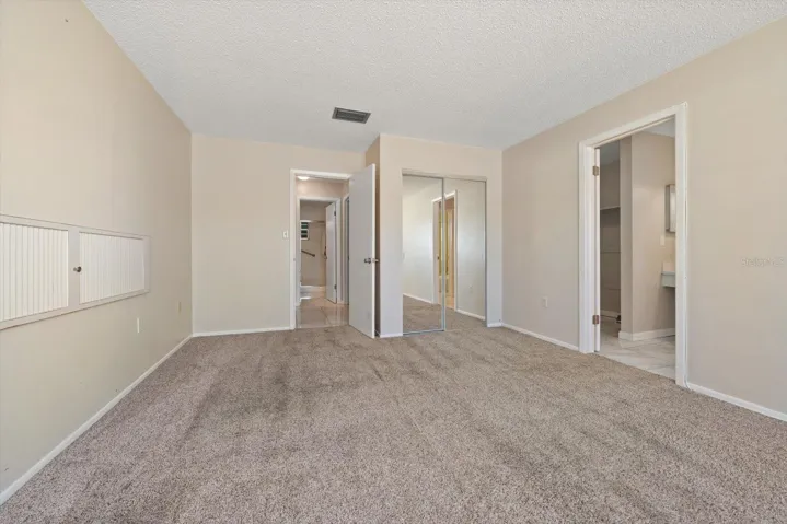 Primary suite with additional closet, en suite bath and walk in closet