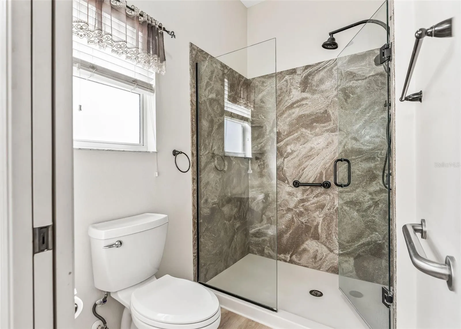Stone Wall Stand-In Shower w/ Safety Bars