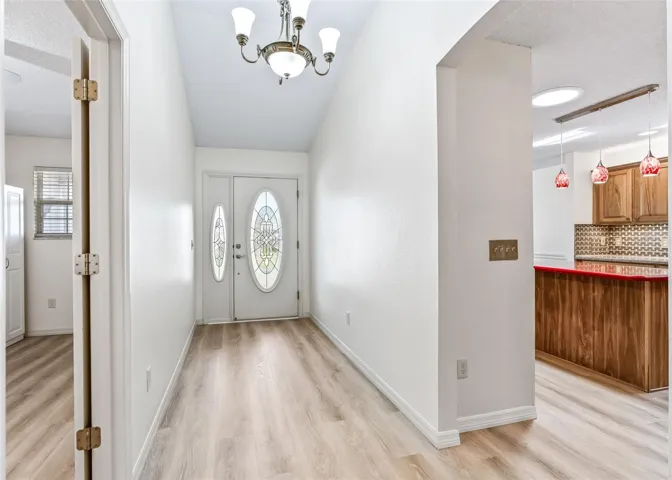 Foyer Entrance to Kitchen &amp; Laundry Room.