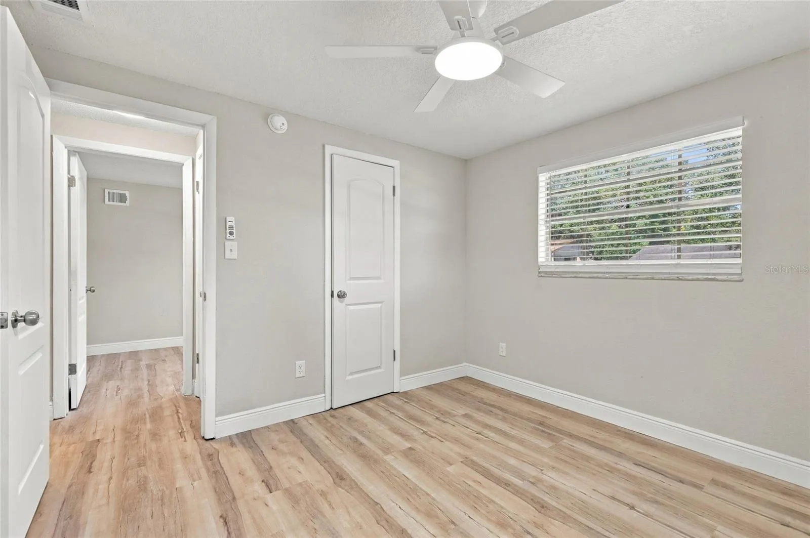 Third bedroom with closet door.