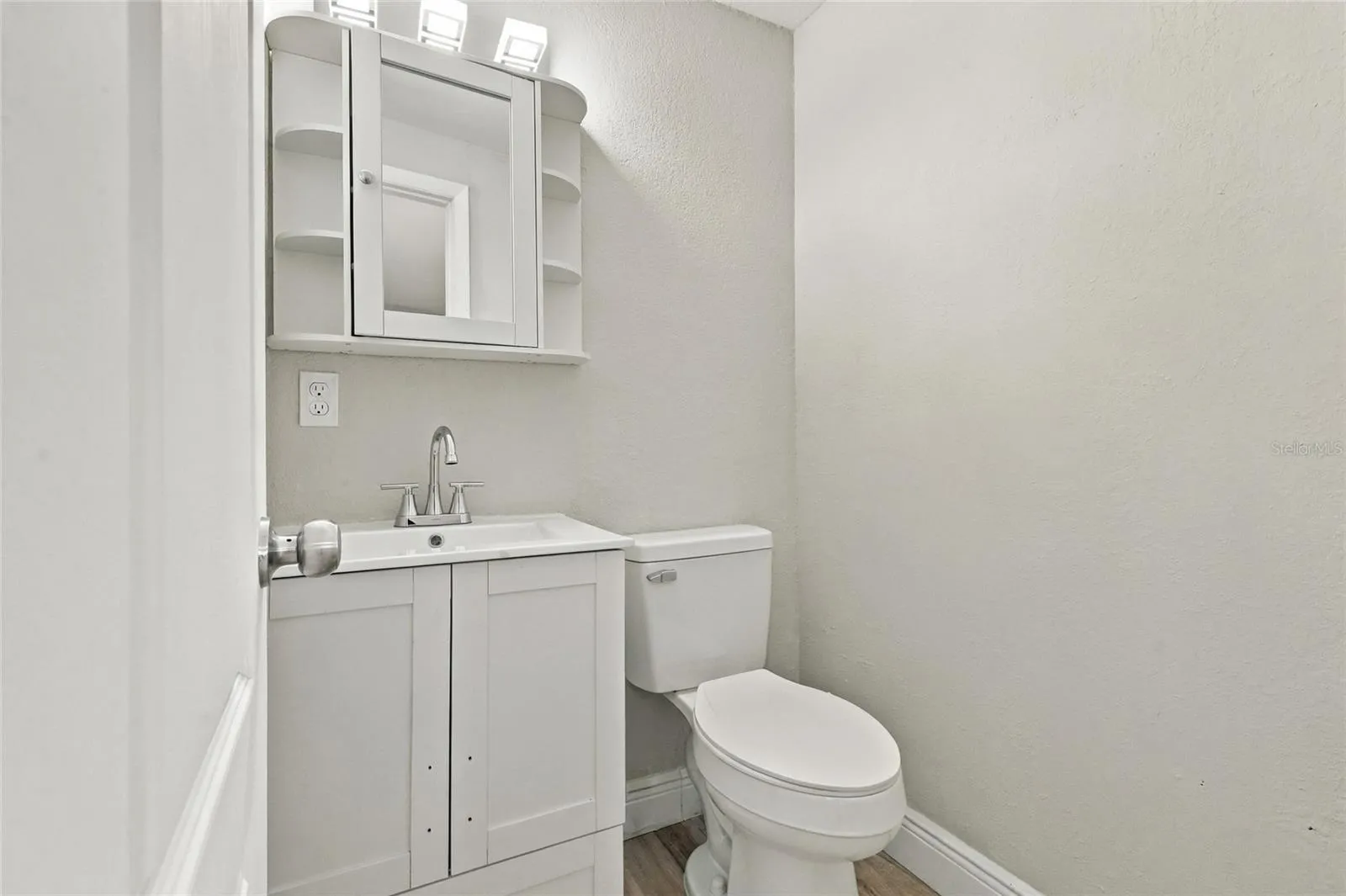 Primary en-suite half bathroom.