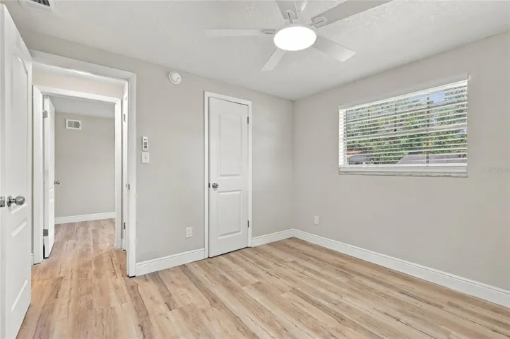 Third bedroom with closet door.