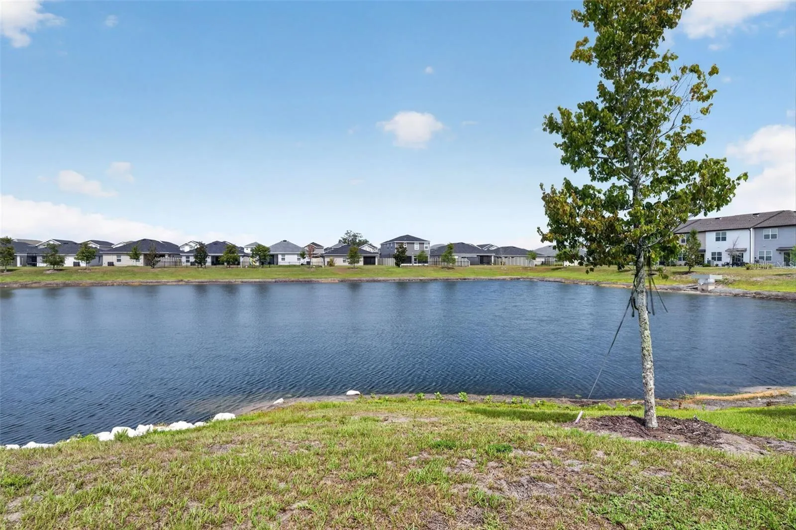 Community pond facing front of Townhome
