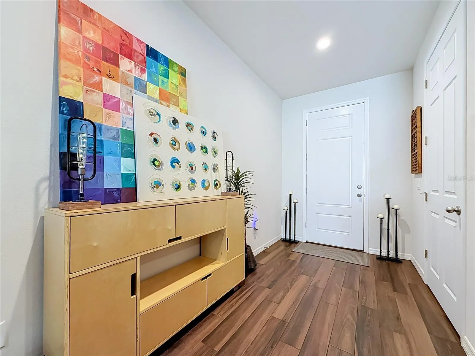 Step inside to discover a spacious OPEN FLOOR PLAN with soaring ceilings and beautiful WOOD-LOOK TILE flooring throughout the downstairs living areas.