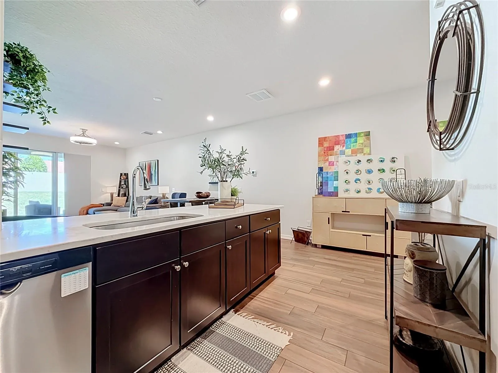 The seamless flow between the kitchen, living, and dining areas makes entertaining a breeze