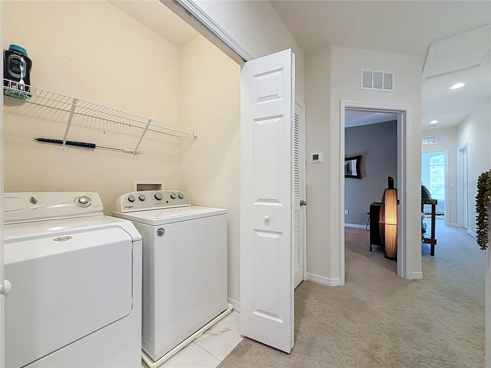 INSIDE LAUNDRY CLOSET with WASHER AND DRYER INCLUDED