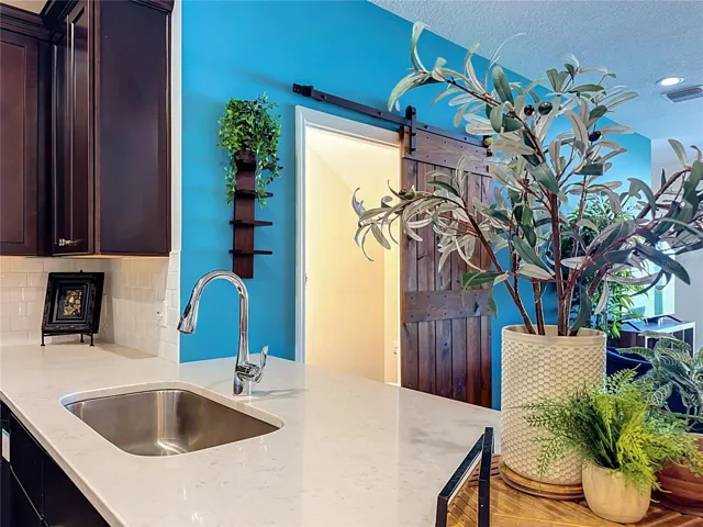 The seamless flow between the kitchen, living, and dining areas makes entertaining a breeze.