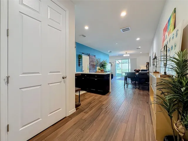 Step inside to discover a spacious OPEN FLOOR PLAN with soaring ceilings and beautiful WOOD-LOOK TILE flooring throughout the downstairs living areas.