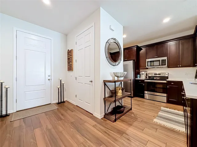 Step inside to discover a spacious OPEN FLOOR PLAN with soaring ceilings and beautiful WOOD-LOOK TILE flooring throughout the downstairs living areas.