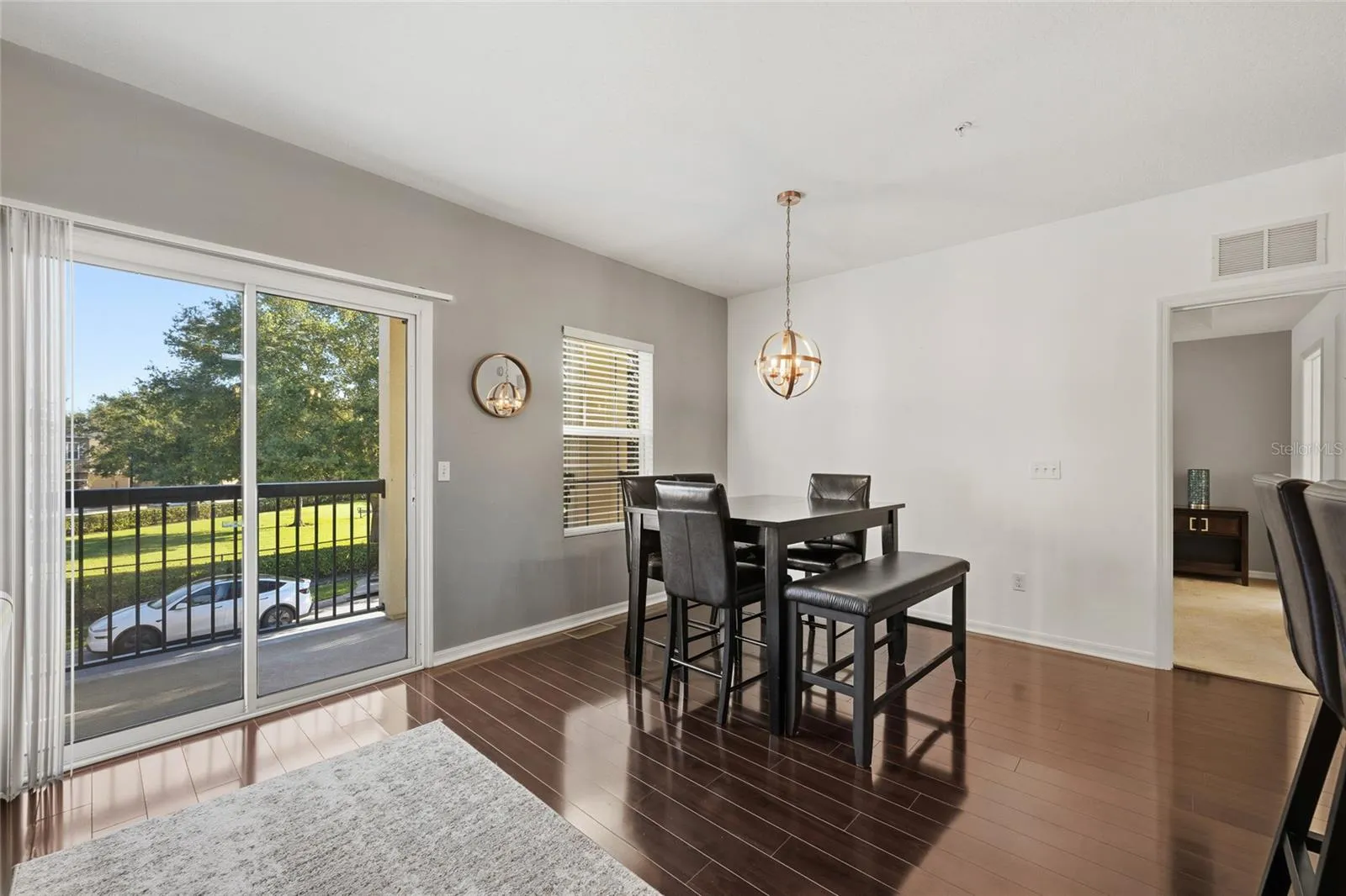 sliding glass door that leads to upper balcony perfect for afternoon relaxation
