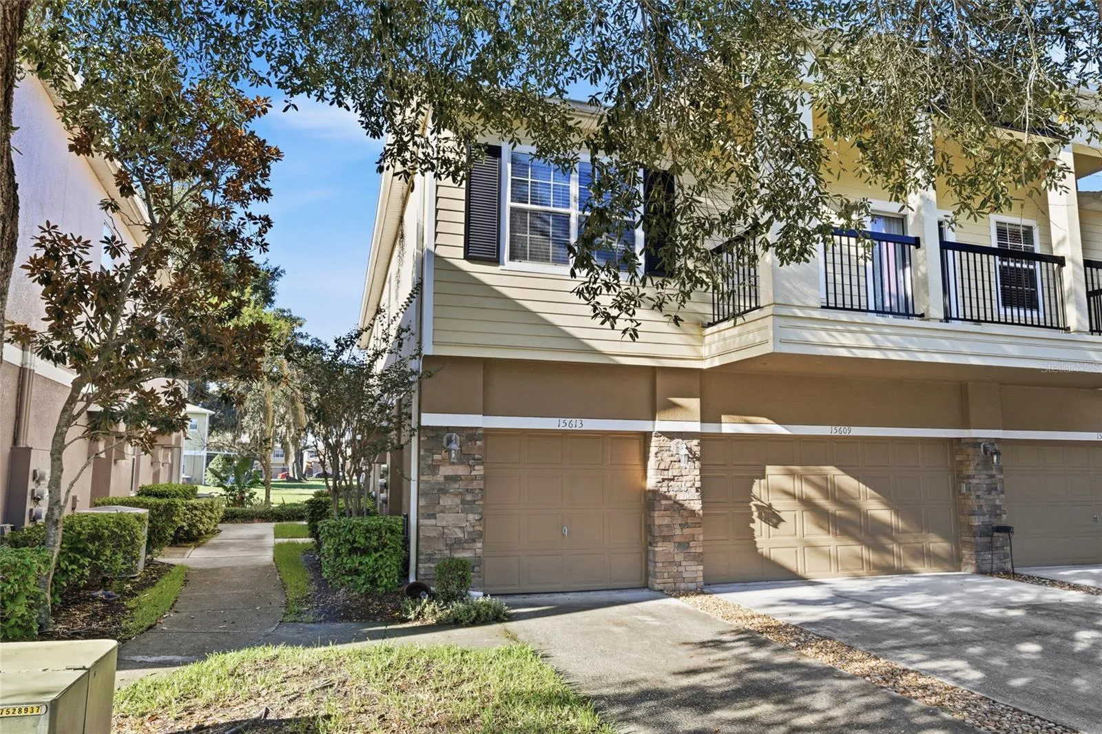 End unit with sidewalk leading to front door