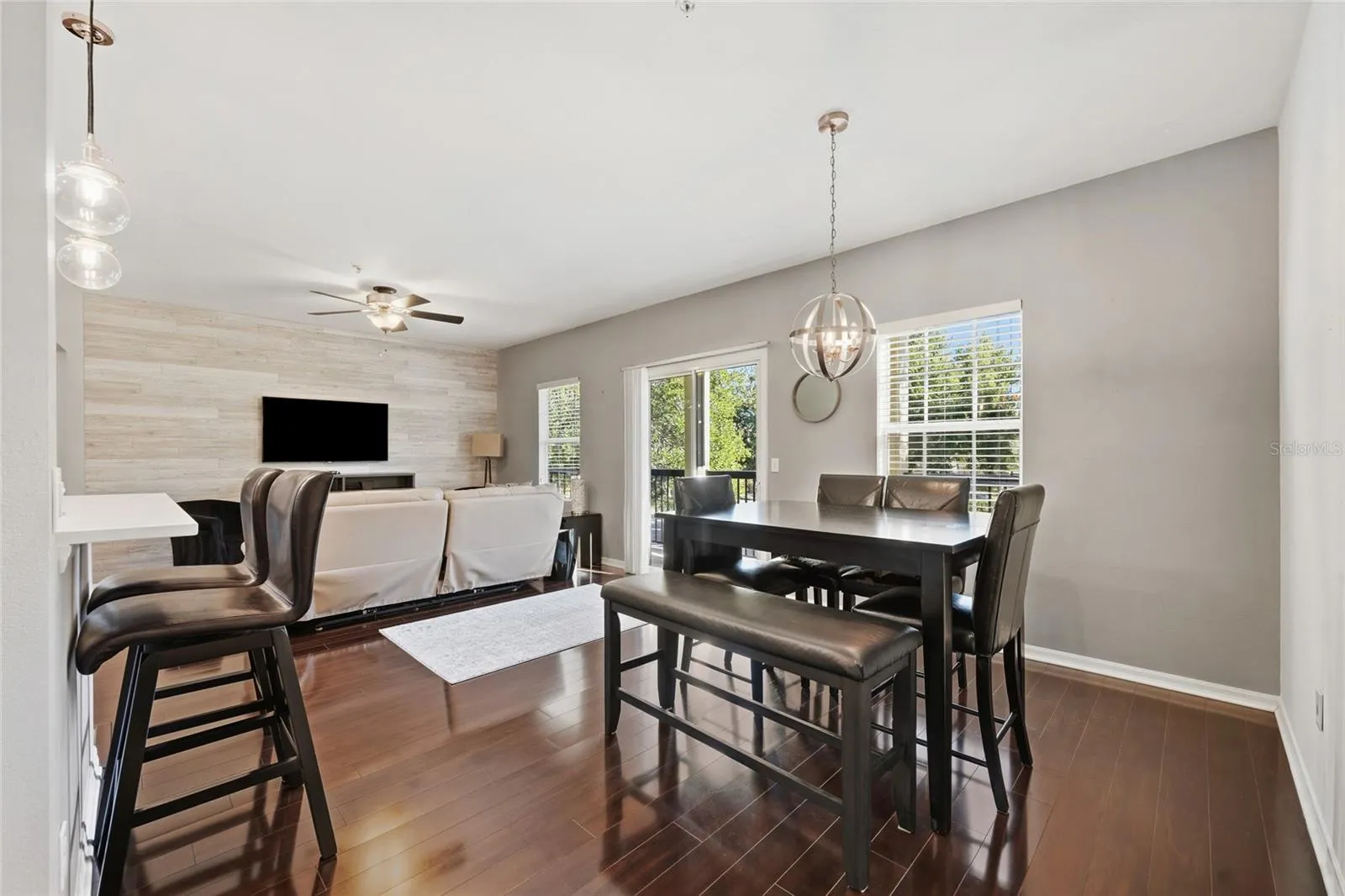 dining area/family room combo area with sliding glass door that leads to balcony