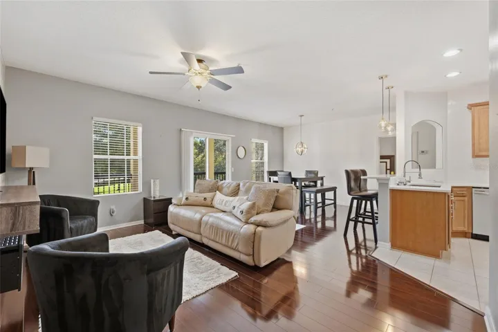 Open concept family dining area combo with Kitchen featuring laminate floors, ceiling fan