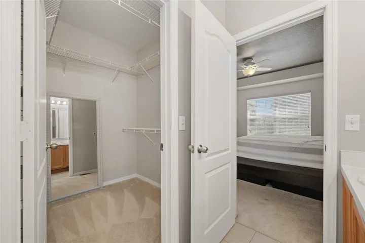Primary bedroom walk in closet