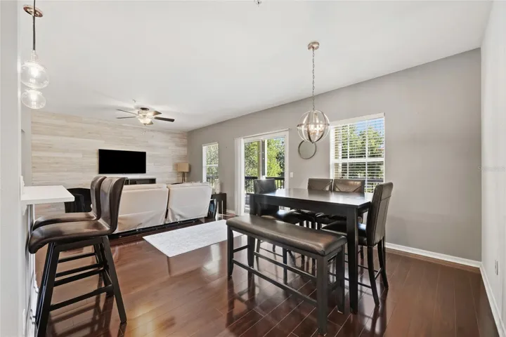 dining area/family room combo area with sliding glass door that leads to balcony