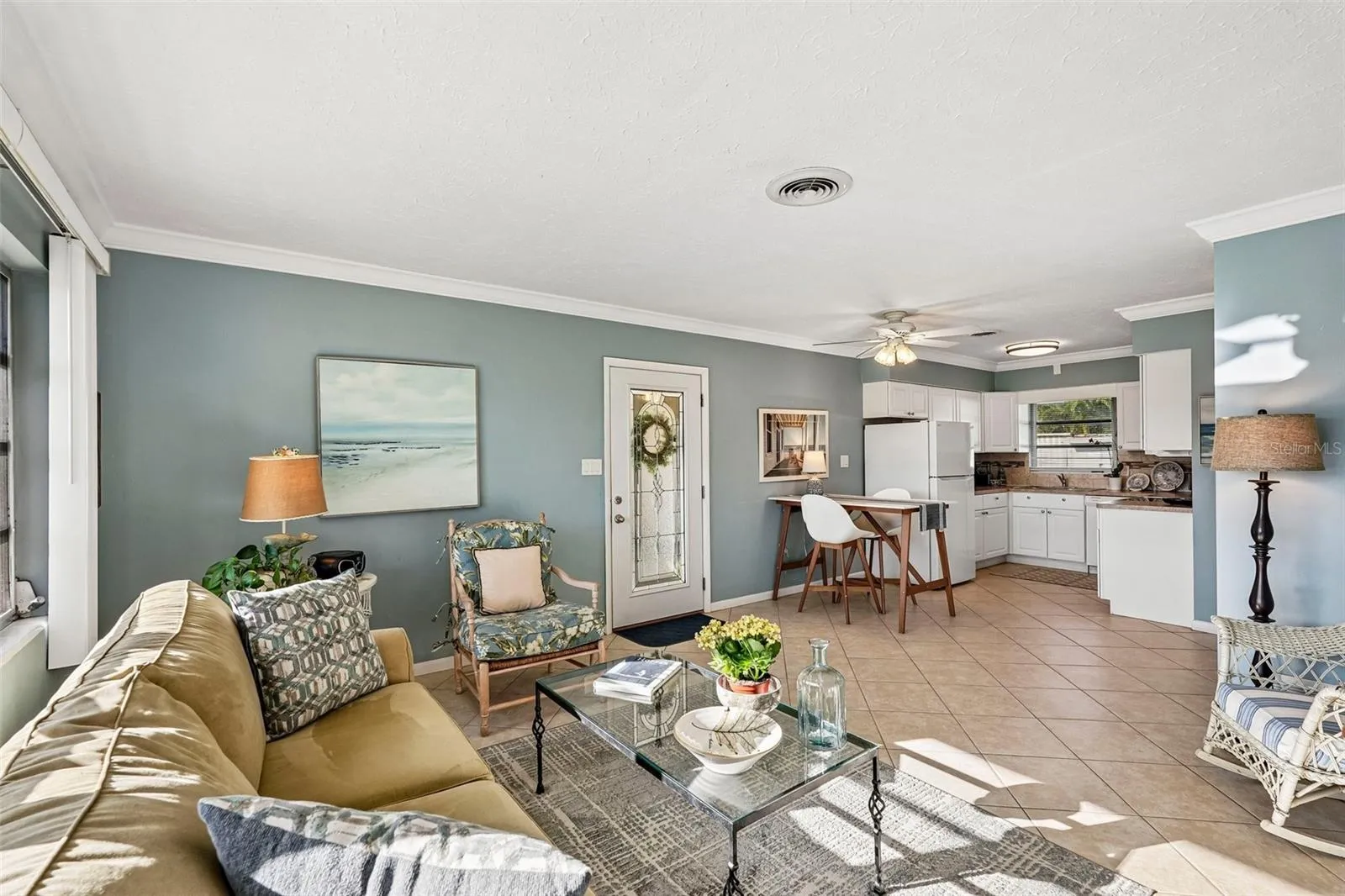 311 open plan living room, door leads to carport & laundry / utility room