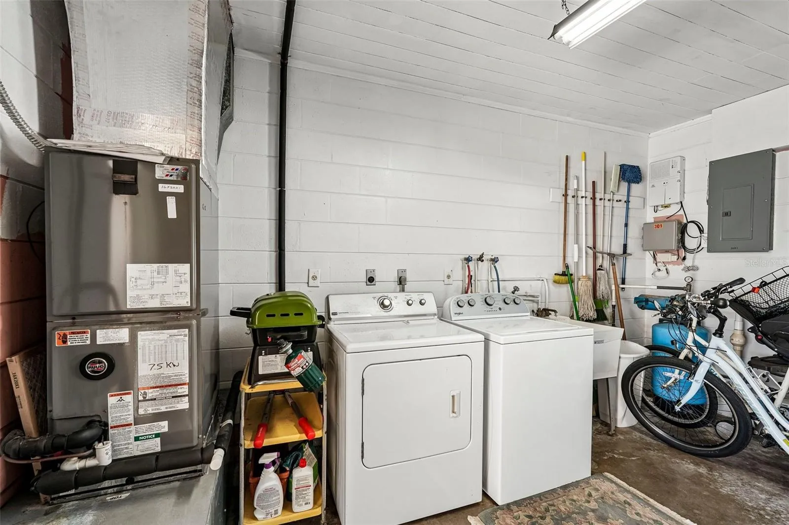 Shared laundry / utility room plus storage.