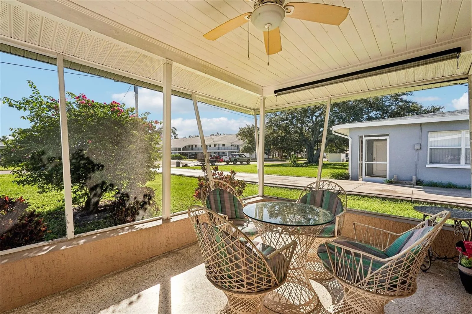 309 - Step outside your living room to the private screened lanai.