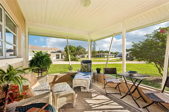 311 screened lanai with travertine floor - perfect for morning coffee