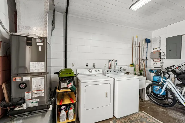 Shared laundry / utility room plus storage.