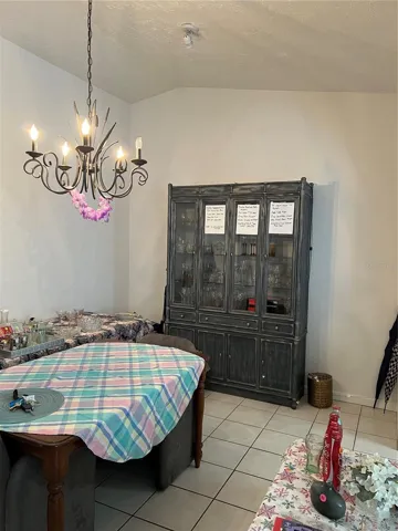The other side of dining room. Light decor to keep people from hitting their head while the table was moved.