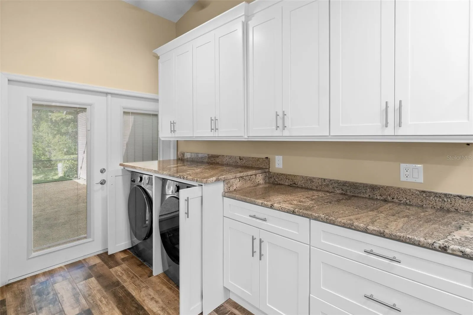 laundry/kitchen storage and doors leading to the lanai