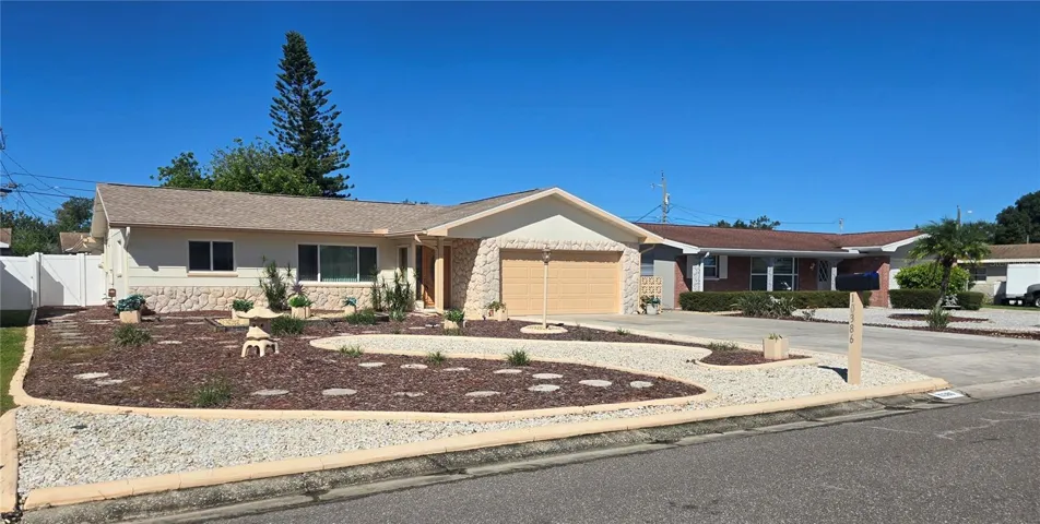 This home features a huge driveway and a maintenance free yard
