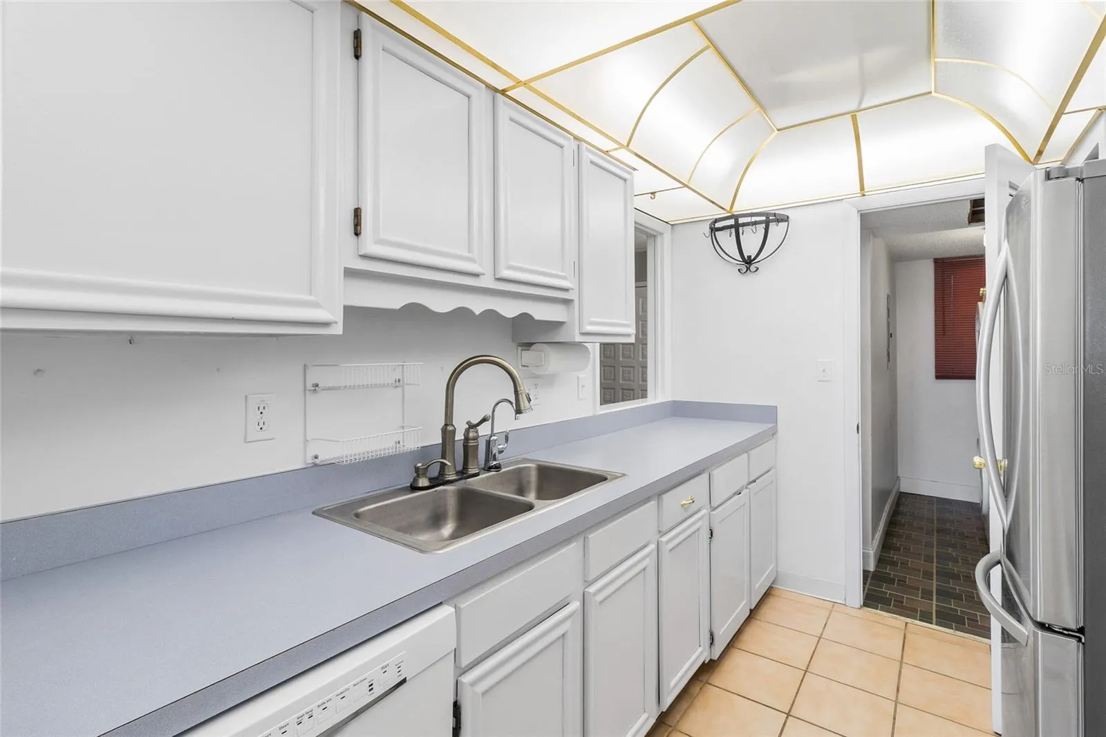 Kitchen looking toward interior laundry room