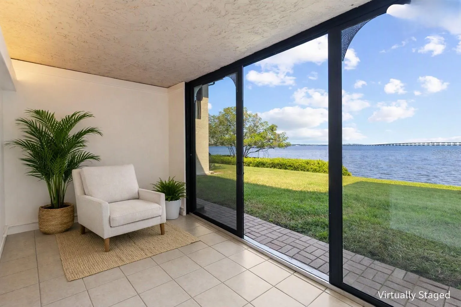 Virtually staged sunroom from other side - with panoramic water views
