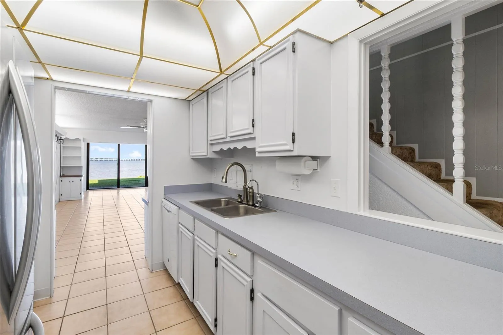 Kitchen other side looking toward living area and water view