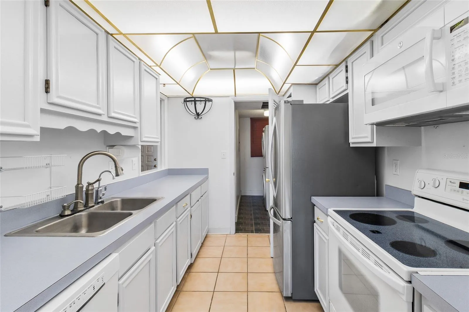 Kitchen looking toward interior laundry room